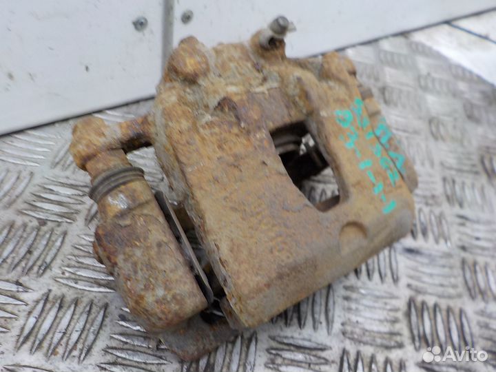 Суппорт тормозной передний левый Kia Rio 2011