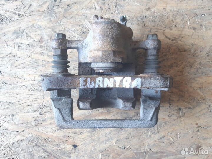 Суппорт задний левый Hyundai Elantra 2006-2011