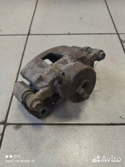 Суппорт тормозной передний левый Daewoo Gentra