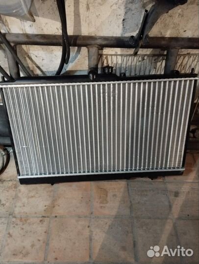 Новый радиатор митсубиси лансер 9
