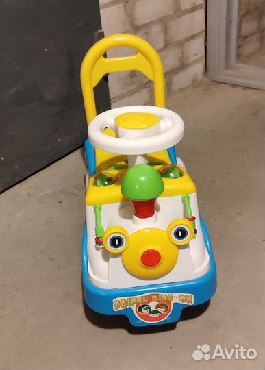Машинка каталка музыкальная
