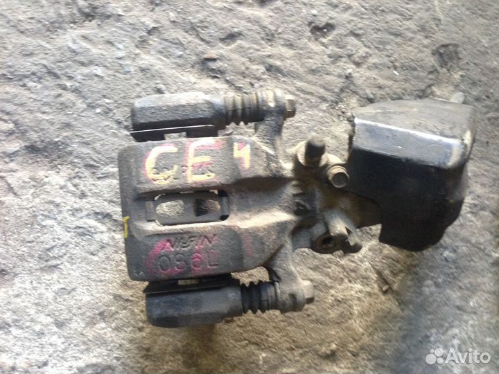 Суппорт задний L mazda 626 GE