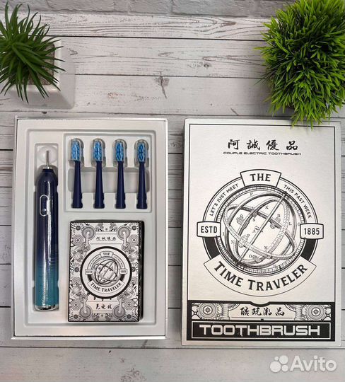 Электрическая зубная щетка