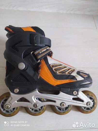 Роликовые коньки