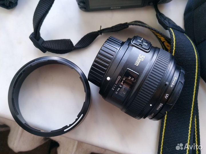 Зеркальный фотоаппарат nikon d3100 с 35mm, 50mm