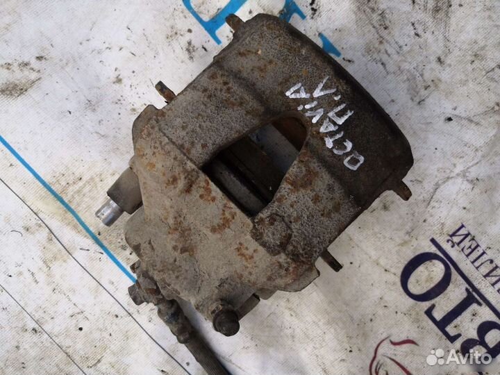 Передний левый тормозной суппорт Scoda Octavia A4