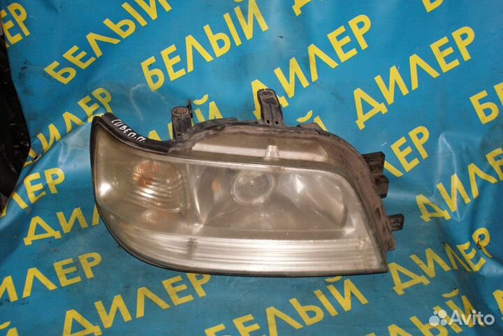 Фара Nissan Cube