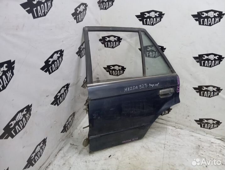 Дверь задняя левая Mazda 323