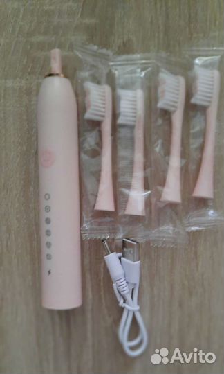 Электрическая зубная щетка