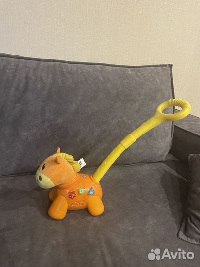 Музыкальная каталка лошадка