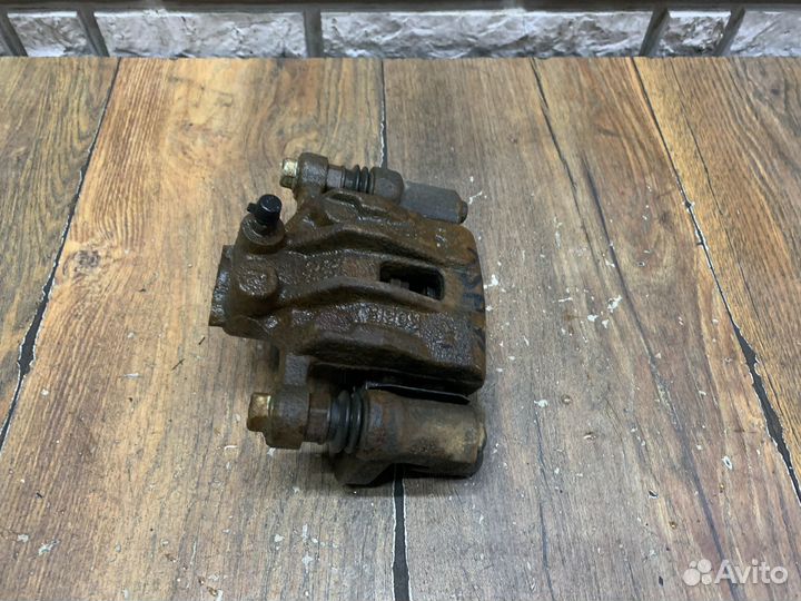 Kia Sportage Суппорт тормозной задний LH RH