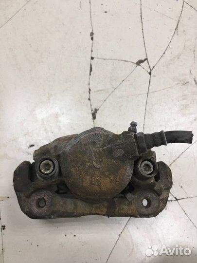 Суппорт тормозной передний левый Kia Shuma