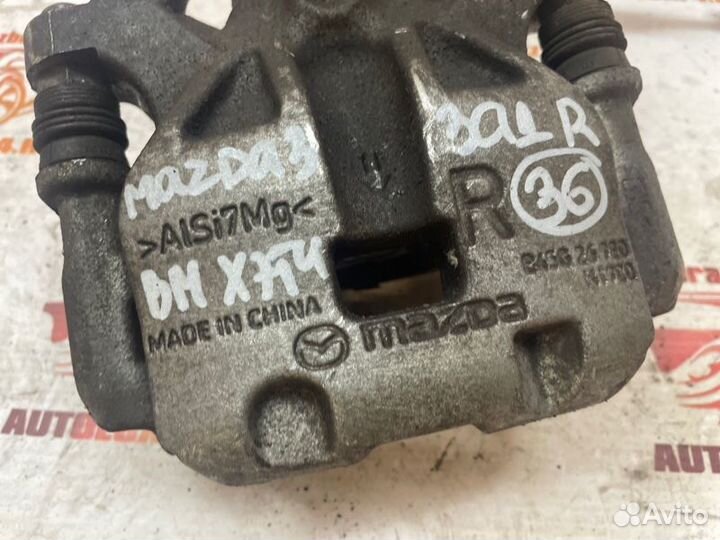 Суппорт тормозной задний правый Mazda 3 BM хетчбек
