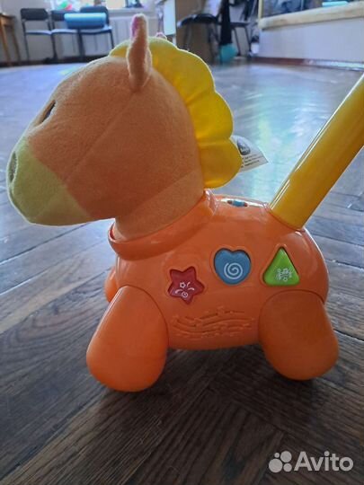 Лошадка каталка музыкальная