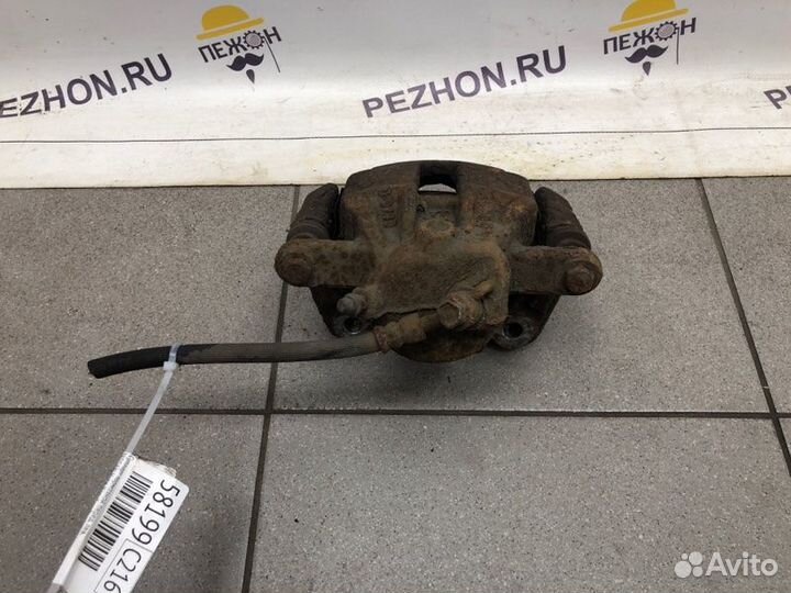 Суппорт тормозной передний левый Nissan Note