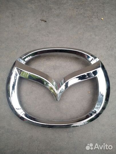 Эмблема мазда