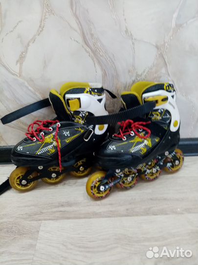 Роликовые коньки