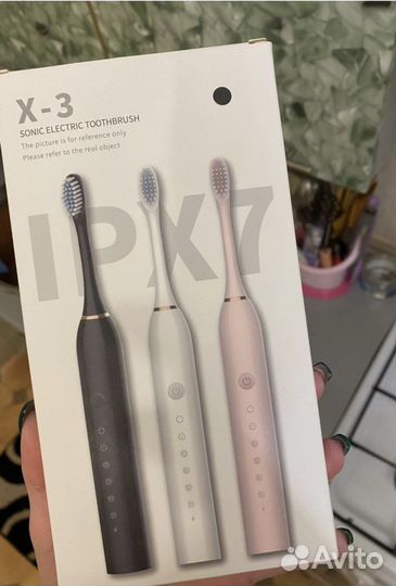 Электрическая зубная щетка