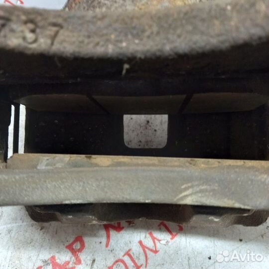 Суппорт тормозной передний левый Mitsubishi Lancer