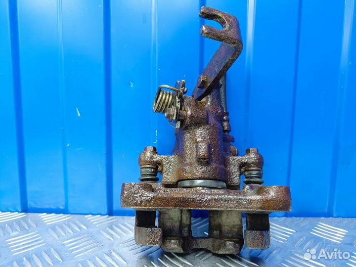 Суппорт задний правый Nissan Almera N16 1.5 QG15DE