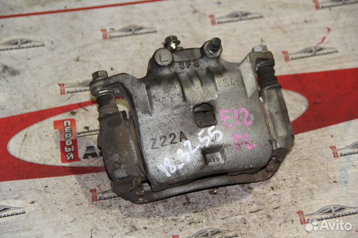 Суппорт перед лево c Nissan Note E12 HR12DE