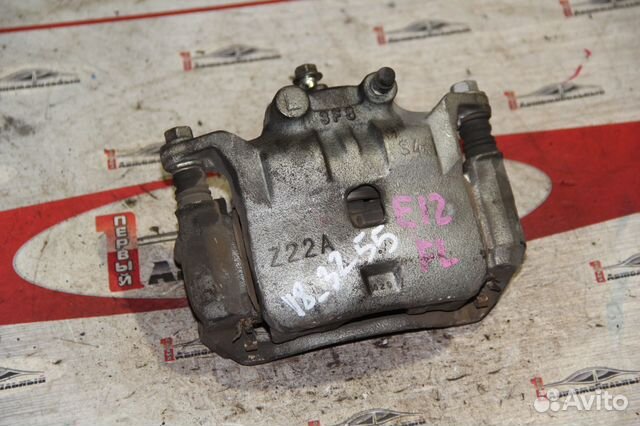 Суппорт перед лево c Nissan Note E12 HR12DE