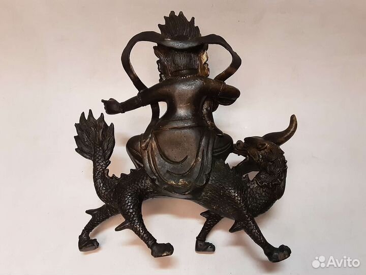 Будда на драконе-единороге.Бронза
