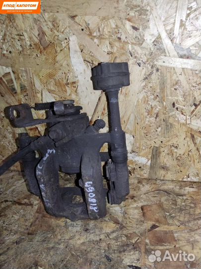 Суппорт тормозной задний левый Opel Astra J