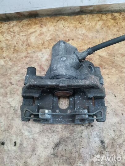 Суппорт тормозной задний левый Ford Focus 2