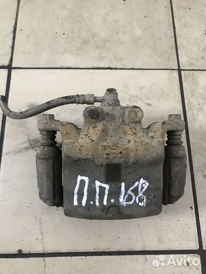 Суппорт тормозной Nissan Teana J32