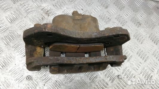 Суппорт тормозной передний правый mitsubishi outla