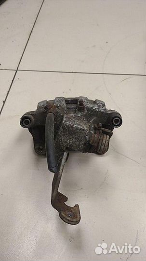 Суппорт задний левый Nissan Primera