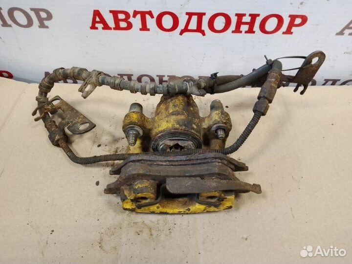 Суппорт тормозной задний левый Dodge Caravan 3.3