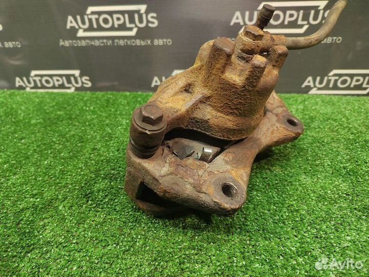 Суппорт передний правый Mitsubishi Lancer X седан