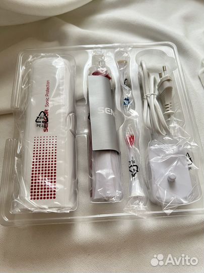 Электрическая зубная щетка новая