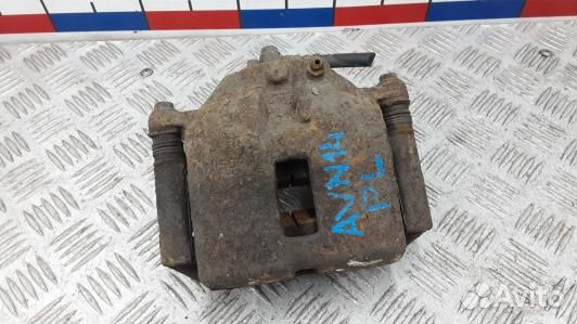 Суппорт тормозной передний левый nissan primera P1