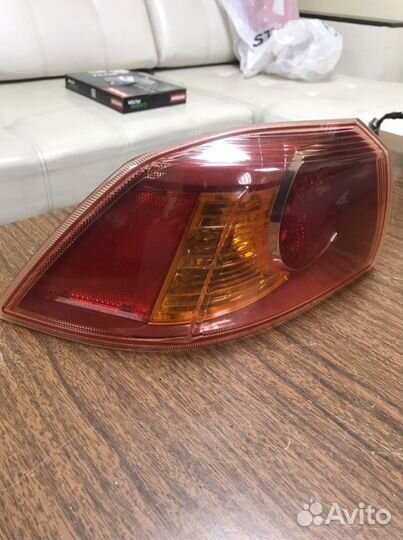 Фонарь левый в крыло Mitsubishi Lancer 10 X