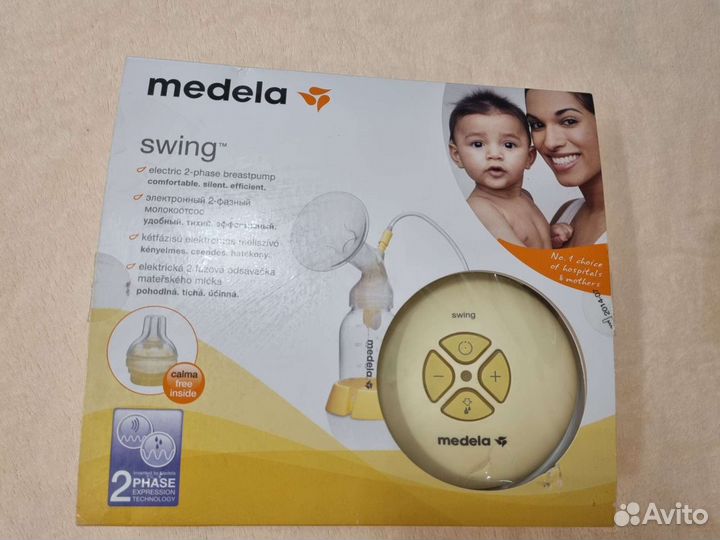 Молокоотсос medela электрический