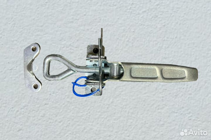 Защелка опракидования для кузова бортового прицепа