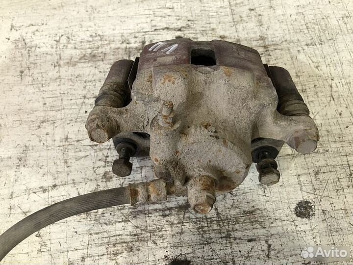 Суппорт передний тормозной Nissan Almera N15