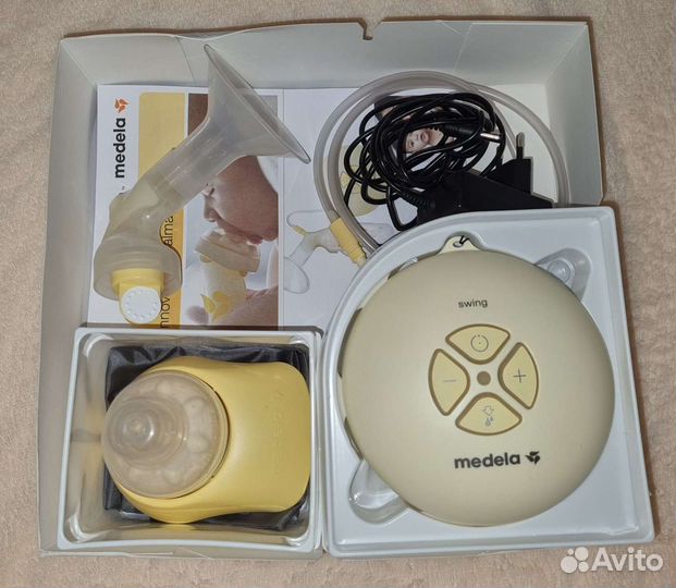 Молокоотсос medela электрический