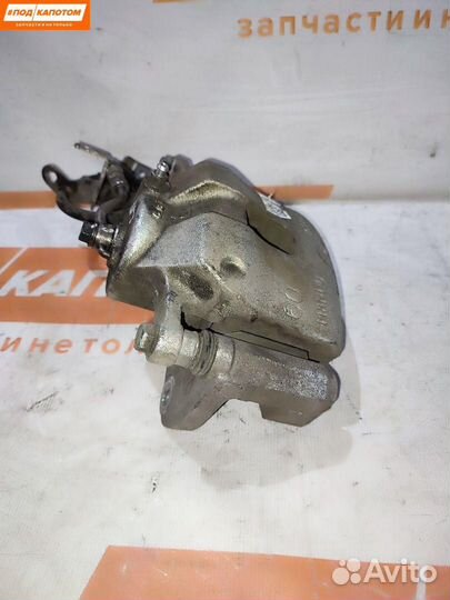 Суппорт тормозной передний левый Kia Sportage 4