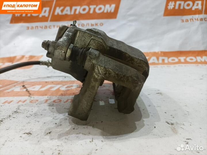 Суппорт тормозной передний левый Nissan Teana J32