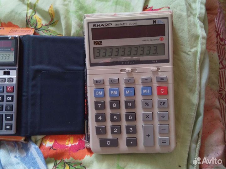 Электронный калькулятор sharp