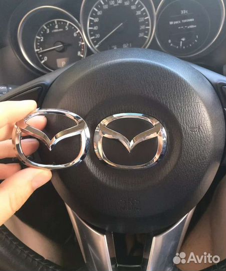 Эмблема, шильдик на руль Mazda