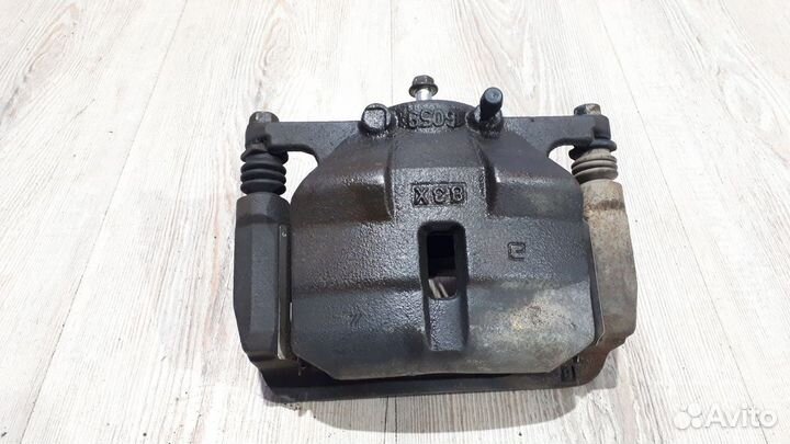 Суппорт тормозной перед Nissan X-trail T31 Лев