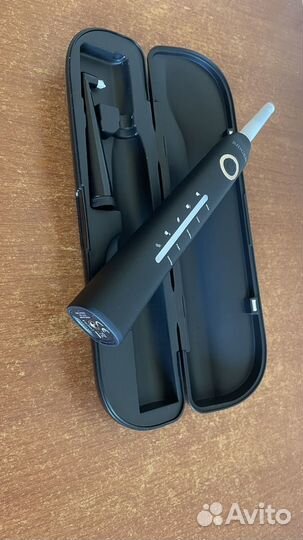 Электрическая зубная щетка