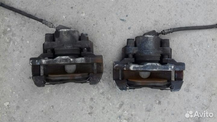 Суппорт передний тормозной мазда демио