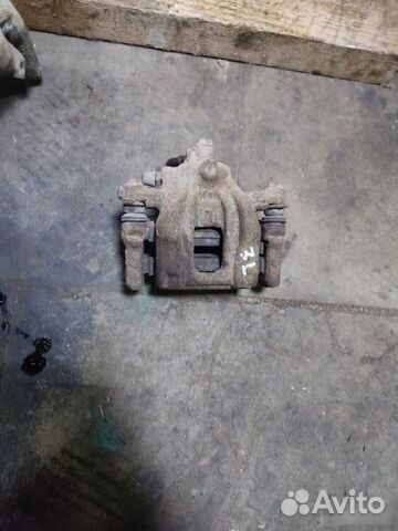 Суппорт тормозной задний левый Honda Cr-V 3