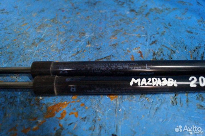 Амортизатор крышки багажника Mazda 3 BL